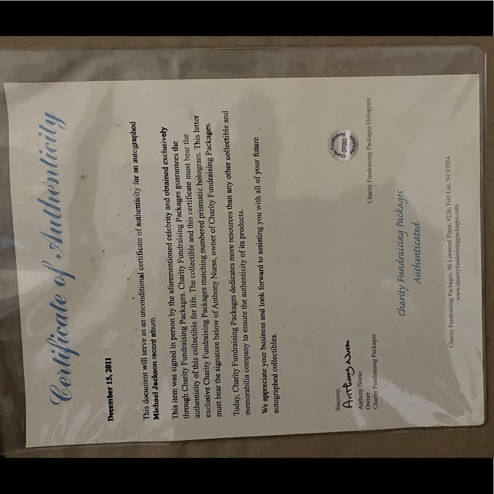 Micheal Jackson autograph thriller album with authenticity certificate